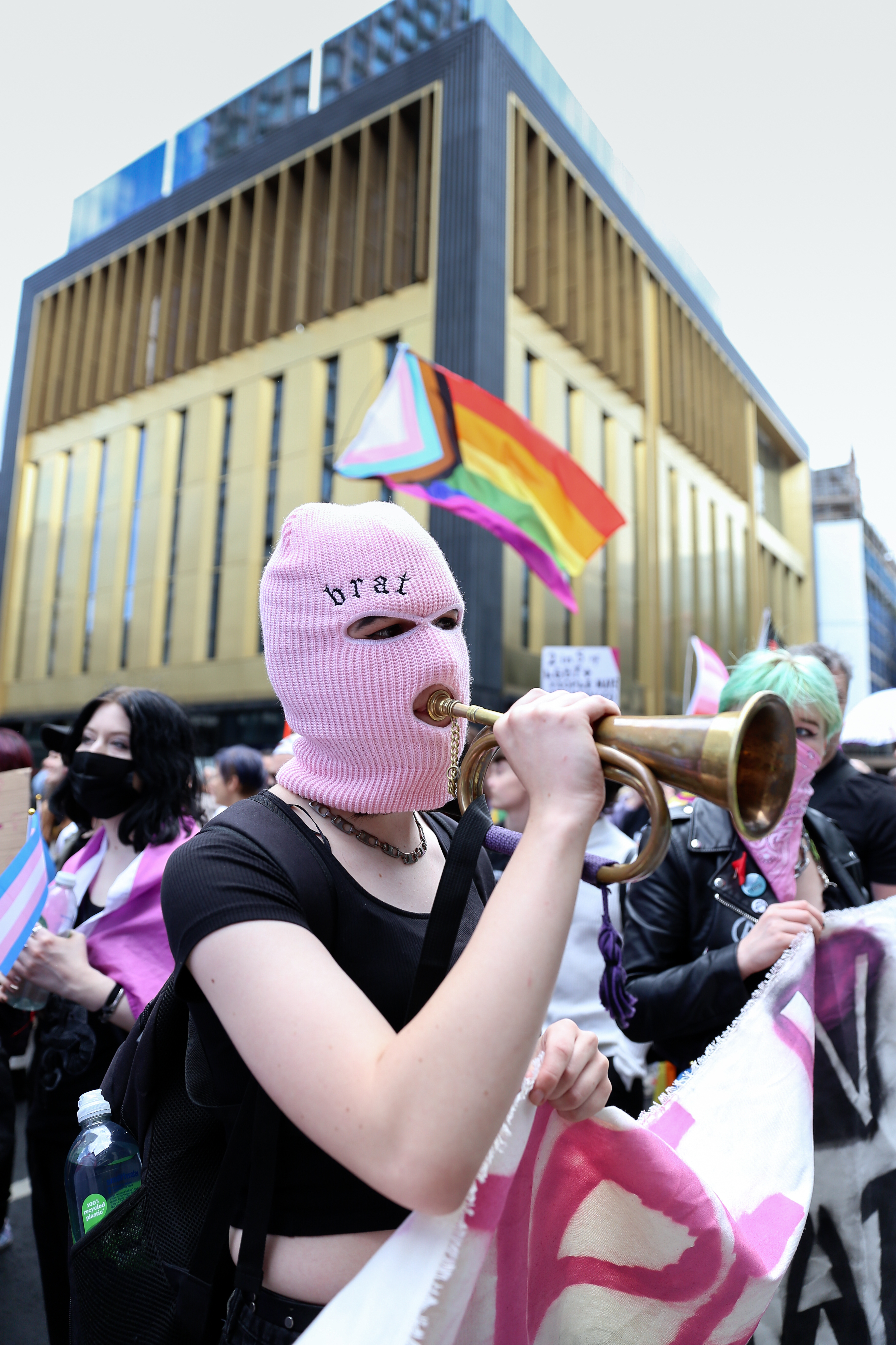 Gay Liberation Front march attendee in pink balaclava