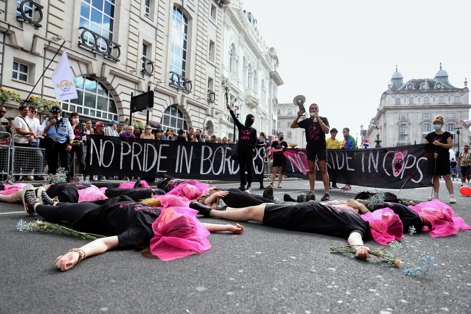 London Pride 2022: Lesbian and Gays Support the Migrants activists lying on ground
