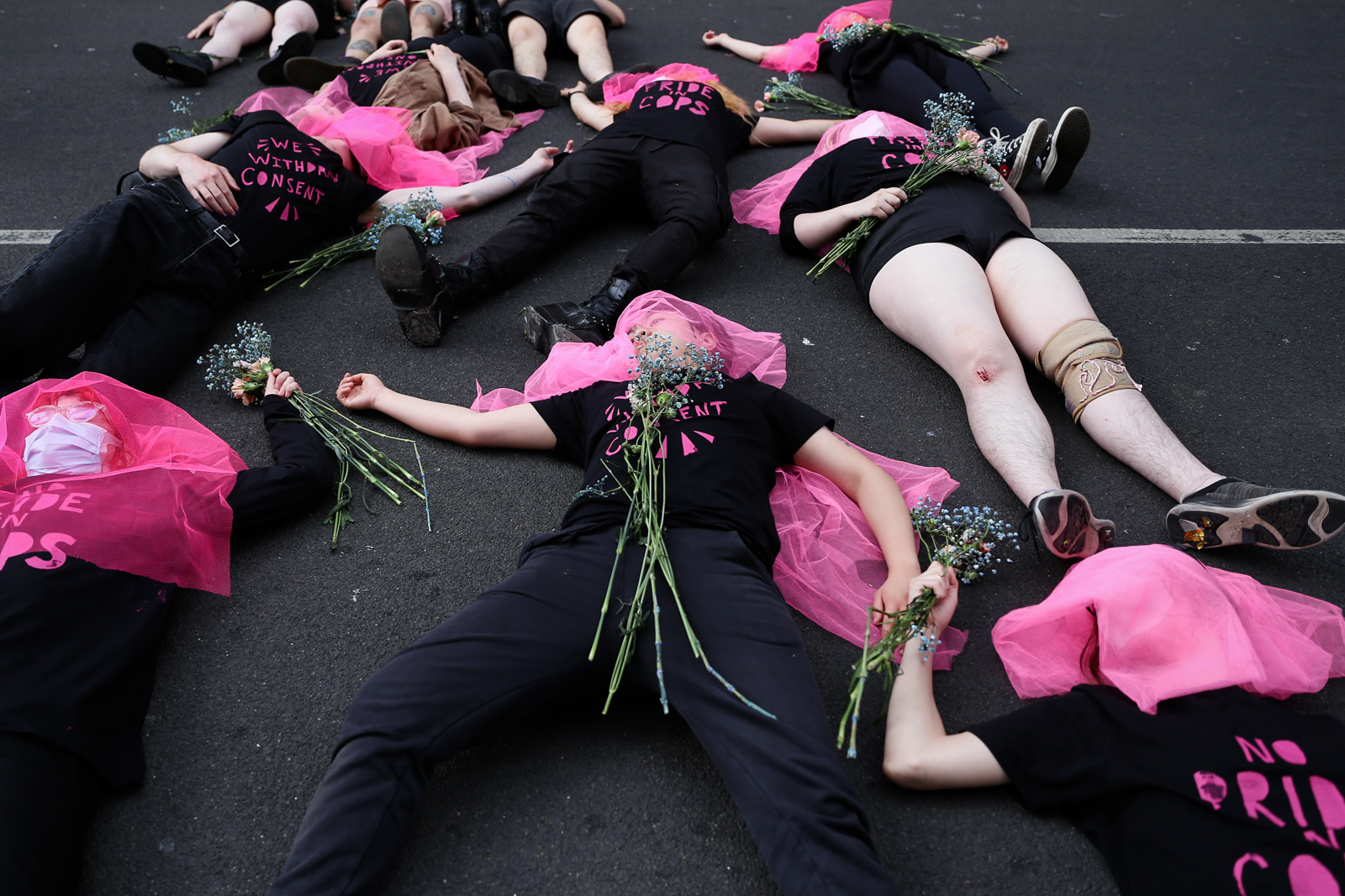 London Pride 2022: Lesbians and Gays Support the Migrants lie on ground during protest