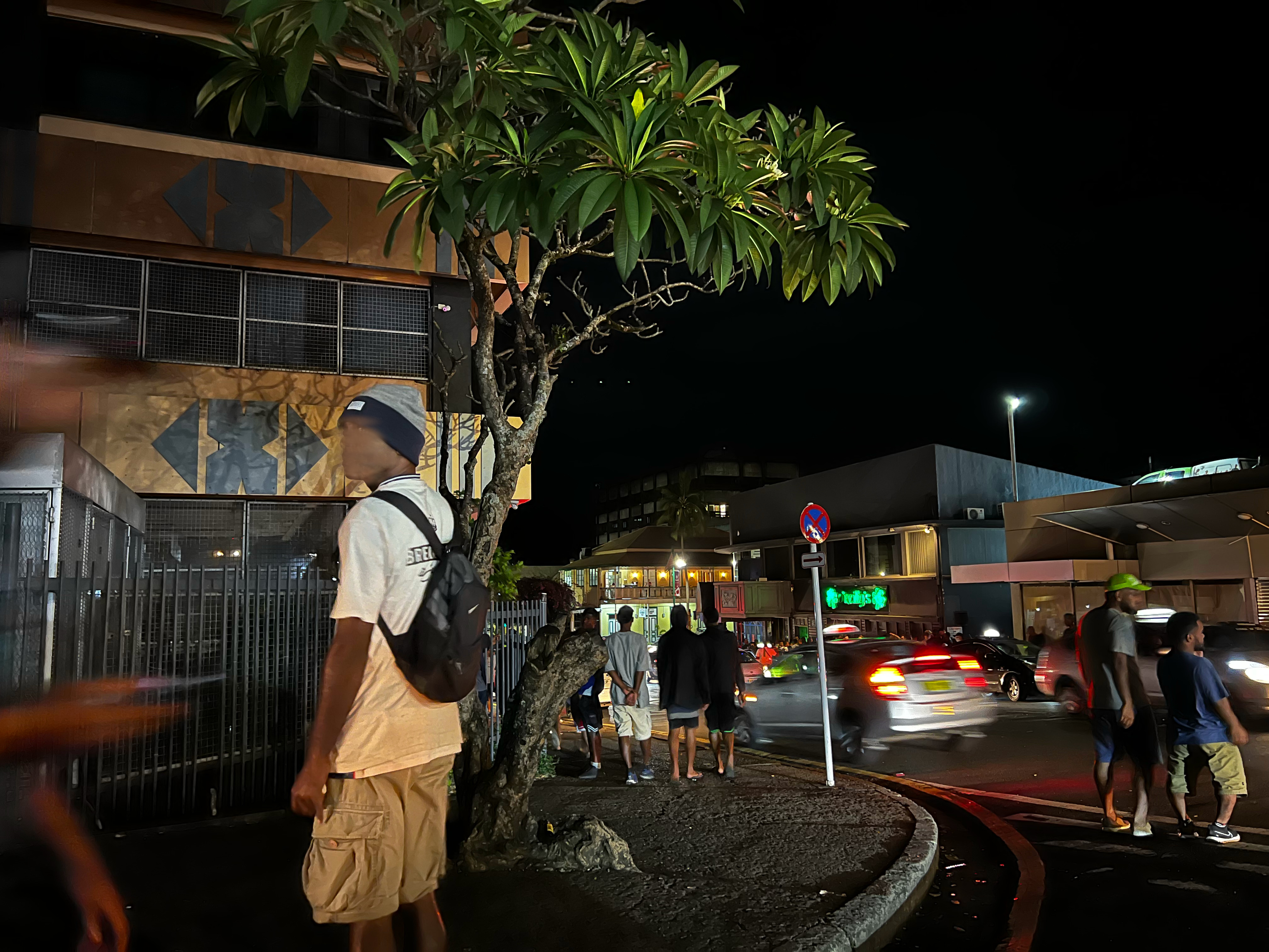 Tourists, locals, and kids walk the streets of central Suva on a Saturday night. Taxi drivers claim the city has become more dangerous with the rising prevalence of meth. Photo: Gavin Butler