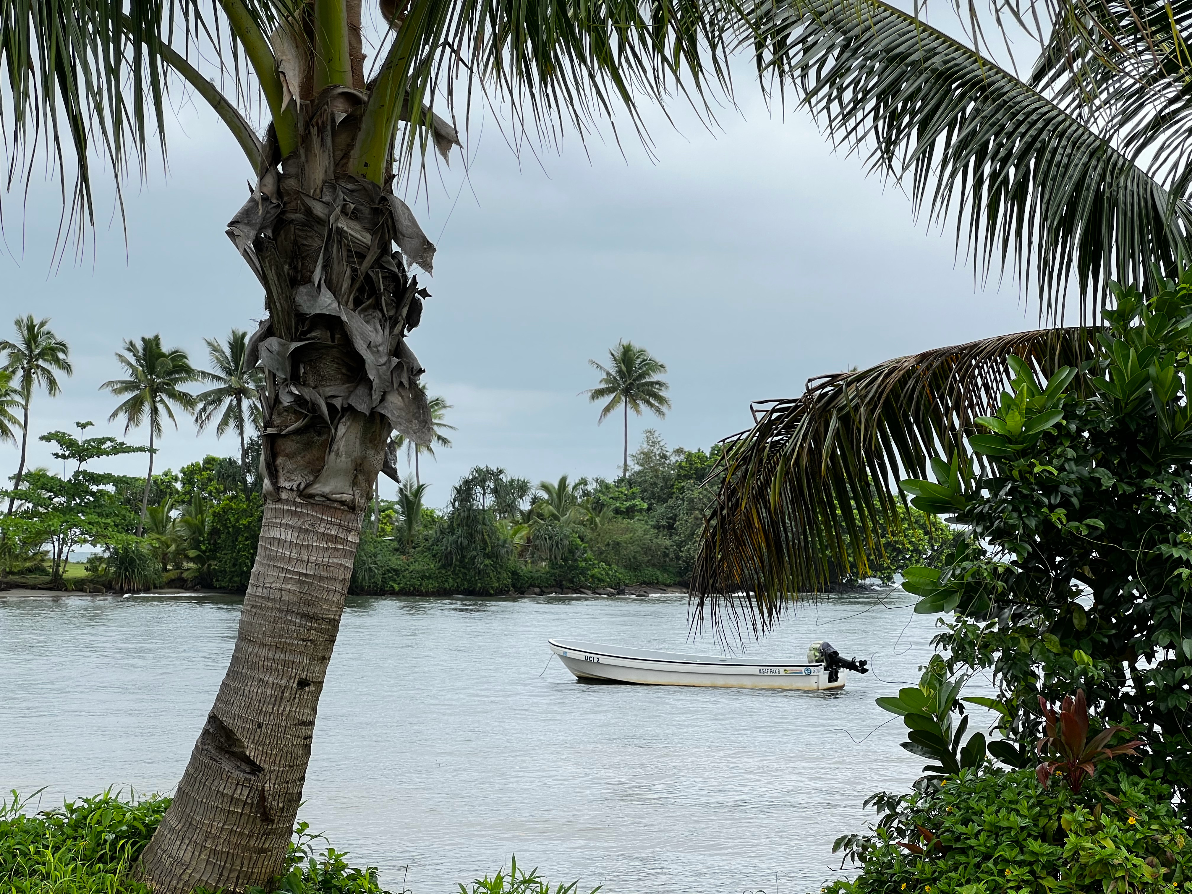 A small fishing vessel sits moored in a bay just outside of Suva. Photo: Gavin Butler
