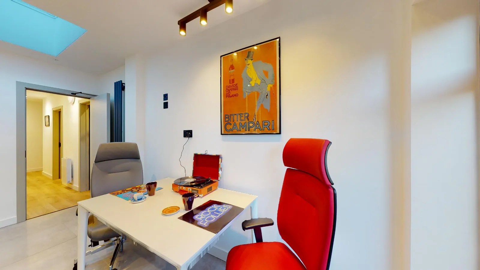 Two gamer chairs in a shared kitchen