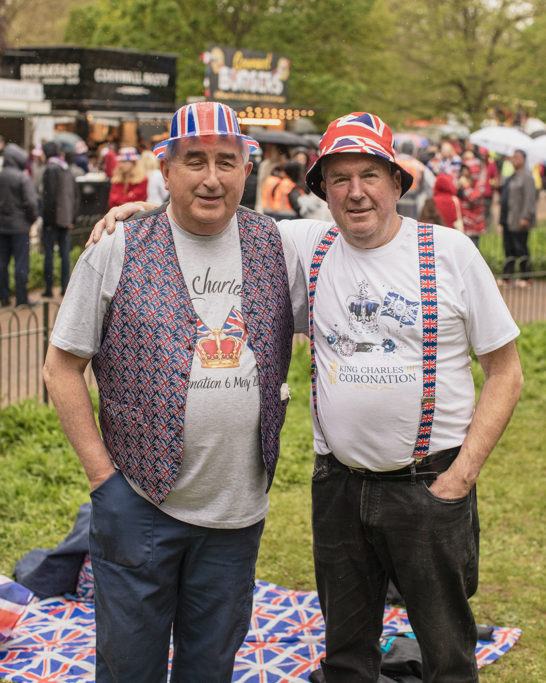 Coronation of King Charles II, London: Two men with arms around each other on lawn
