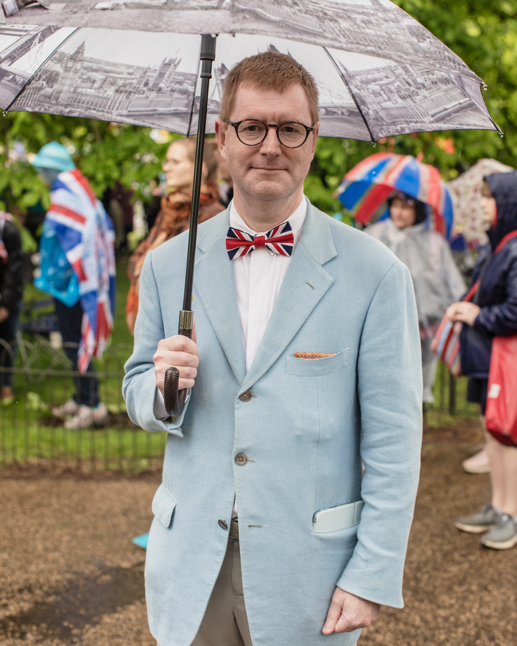 Coronation of King Charles II, London: A man in glasses with Union Jack bow tie