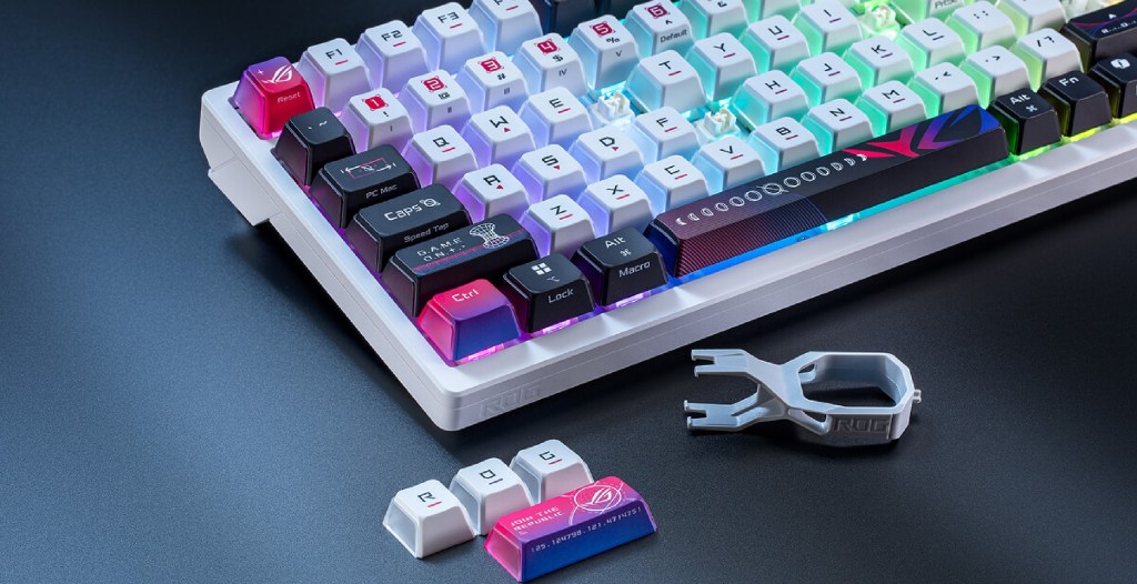 The ASUS Azoth X with a few keys in front of it, headlining a review for this keyboard